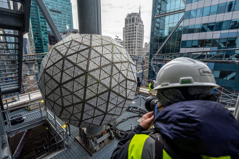 Workers install Waterford Crystal triangles atop One Times Square on Dec. 27, 2022
