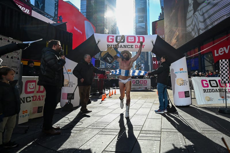 Robert John Burck, aka The Naked Cowboy, participates in the Good Riddance Day obstacle course in Times Square on December 28, 2022 in New York City. This year’s Good Riddance Day event gave participants the opportunity to race through the finish line in an obstacle course format.