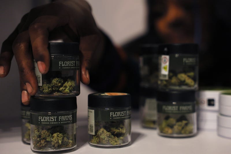 A Housing Works Cannabis Co staff member places marijuana products on a shelf on December 29, 2022 in New York City. New York officials and Housing Works leadership held a press conference ahead of the grand opening of Housing Works Cannabis Co, New York state's first legal cannabis dispensary. It is one of the first recreational cannabis dispensaries to be awarded a CAURD license in the state of New York. All sales from the dispensary will be directed to parent organization Housing Works, Inc and will be used to address HIV/AIDS and homelessness crisis.