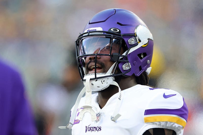 Dalvin Cook #4 of the Minnesota Vikings watches action prior to a game against the Green Bay Packers at Lambeau Field on January 01, 2023 in Green Bay, Wisconsin.