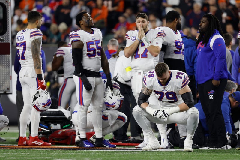 Buffalo Bills players react after teammate Damar Hamlin was injured against the Cincinnati Bengals during the first quarter in Cincinnati, 1/2/23