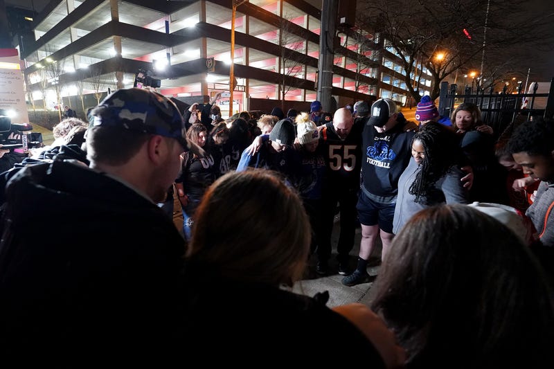 Fans gather for a vigil at the University of Cincinnati Medical Center for football player Damar Hamlin of the Buffalo Bills, who collapsed after making a tackle during the game against the Cincinnati Bengals and was transported by ambulance to the hospital on January 02, 2023 in Cincinnati, Ohio