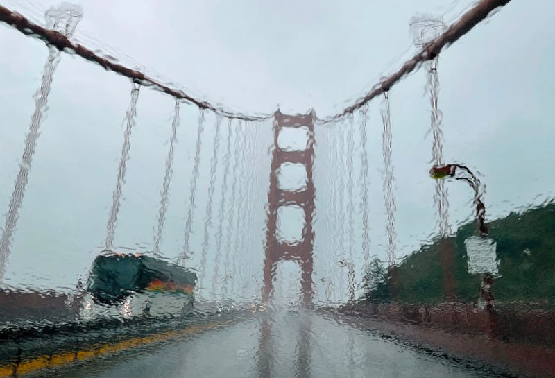 The Golden Gate Bridge is seen through a rain covered windshield on January 04, 2023 in San Francisco, California.