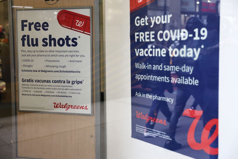 Flu and coronavirus (COVID-19) vaccine signage is seen at a Duane Reade by on Broadway on January 05, 2023 in New York City. 