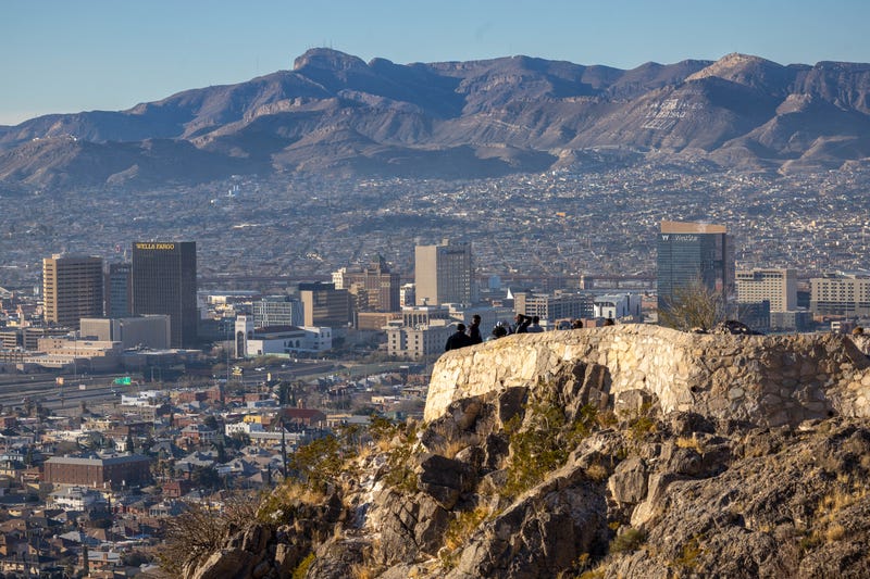 People look over the El Paso skyline and mountains across the border in Juarez, Mexico on Jan. 8, 2023, from El Paso, Texas.