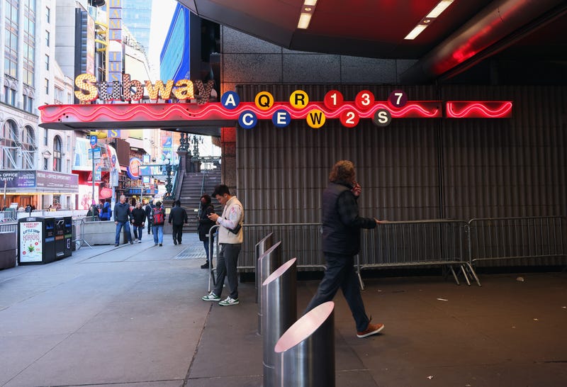 A homeless man caught fire near the Times Square subway stop on Monday morning