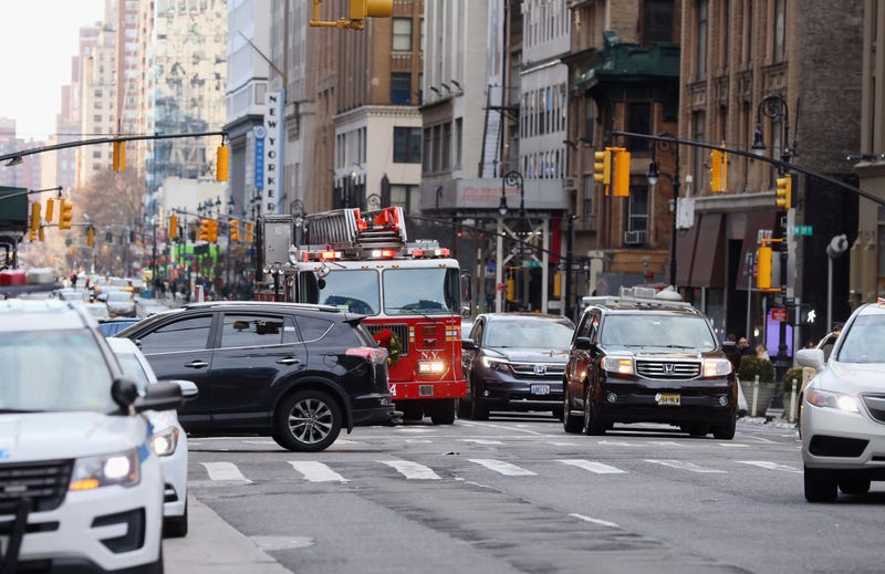 A fire engine works it's way up Eight Avenue near Times Square in New York.
