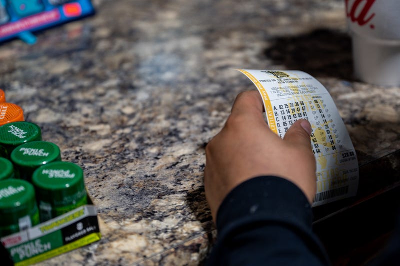 A customer purchases a lottery ticket at a CITGO gas station on Jan. 10, 2023, in Austin, Texas.