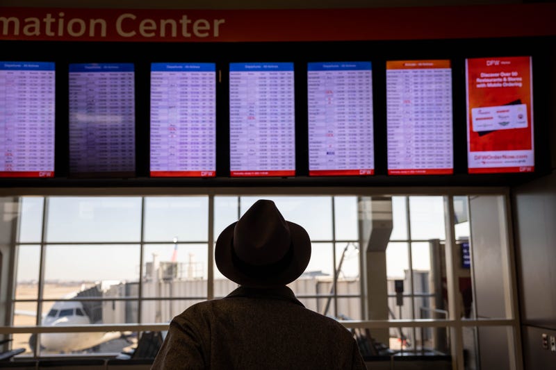 Passengers pass through Dallas-Fort Worth International Airport (DFW) on January 11, 2023 in Dallas, Texas.