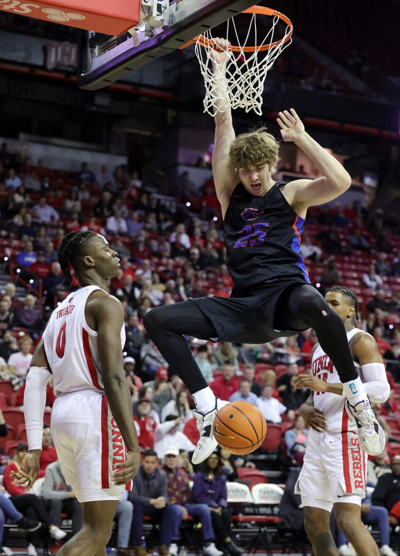 Lukas Milner #25 of the Boise State Broncos dunks against Victor Iwuakor #0 of the UNLV Rebels in the second half of their game at the Thomas & Mack Center on January 11, 2023 in Las Vegas, Nevada. The Broncos defeated the Rebels 84-66.