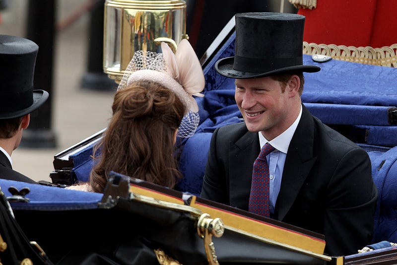 Prince Harry smiles during the Diamond Jubilee carriage procession after the service of thanksgiving at St.Paul's Cathedral on The Mall on June 5, 2012 in London, England.