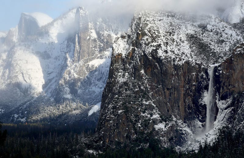 Water flows from Bridalveil Fall (R) in Yosemite Valley, after the last of a series of atmospheric river storms passed through, on January 19, 2023 in Yosemite National Park, California.