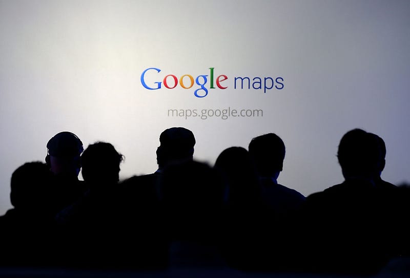 Members of the media watch a slideshow during a news conference about Google Maps on June 6, 2012 in San Francisco, California.