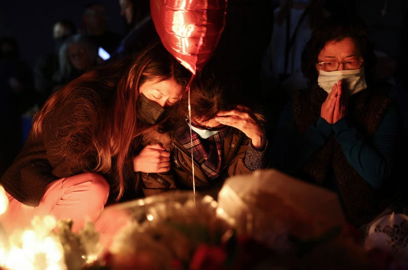 People gather at a candlelight vigil for victims of a deadly mass shooting at a ballroom dance studio on January 23, 2023 in Monterey Park, California.
