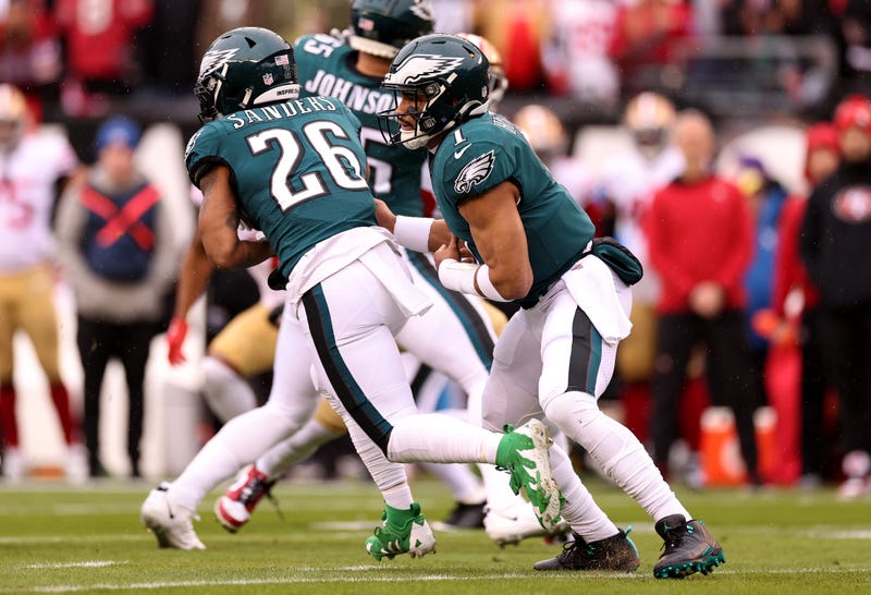 Jalen Hurts (1) hands the ball off to Miles Sanders (26) against the San Francisco 49ers during the first quarter in the NFC Championship Game at Lincoln Financial Field on Jan. 29, 2023, in Philadelphia, Pennsylvania.