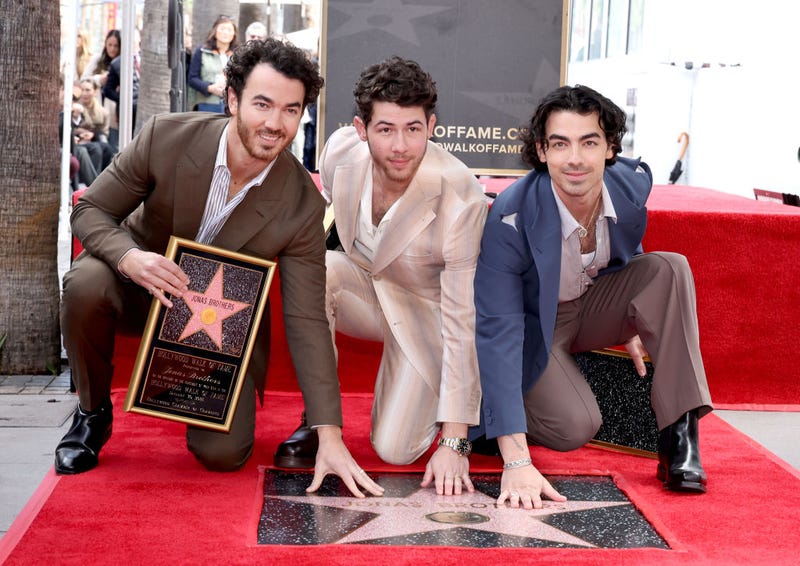 (L-R) Kevin Jonas, Nick Jonas, and Joe Jonas of The Jonas Brothers attend The Hollywood Walk of Fame star ceremony honoring The Jonas Brothers on January 30, 2023 in Hollywood, California.