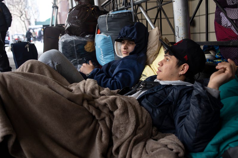 Venezuelan migrants who had been bused to New York from the Texas border refuse to leave for a city run migrant shelter in Brooklyn after being kicked out of their rooms at the Watson Hotel, January 30, 2023 in midtown New York City, New York. Not allowed by police to set up tents, they have camped out with blankets outside of the hotel on west 57th street.