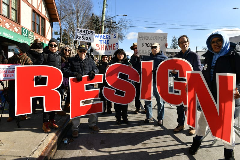 Protesters calling on Santos to resign in front of his Queens district office.