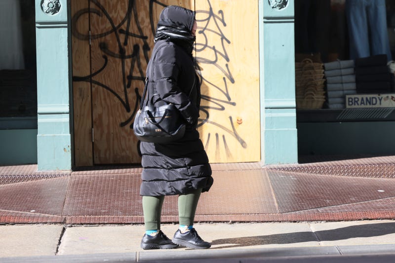 People bundle up as they shield themselves from cold winds as the area is seeing record-breaking low temperatures on February 03, 2023 in New York City. The Northeast U.S. has seen a dramatic drop in temperatures as it is hit by an Arctic front of cold air. The wind chill is expected to drop to negative numbers with temperatures hitting 0 to 10 degrees Fahrenheit in parts of the NYC metro area. (Photo by Michael M. Santiago/Getty Images)