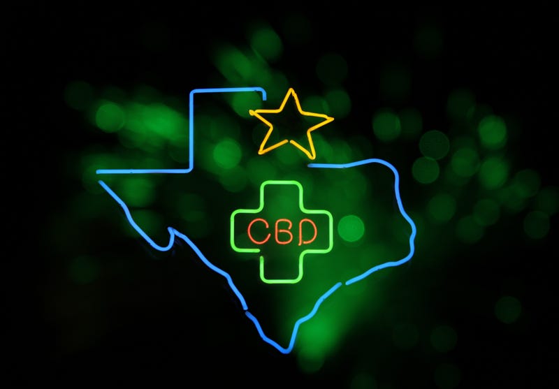 FILE: Neon lights show "CBD" inside the state of Texas.