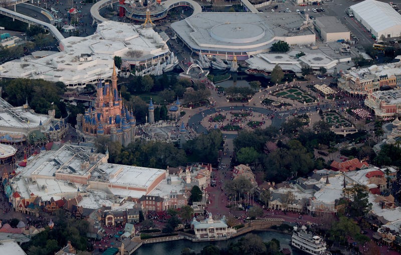 In an aerial view, Walt Disney World's iconic Cinderella Castle sits on the grounds of the theme park on February 08, 2023 in Orlando, Florida. As Florida Gov. Ron DeSantis continues his push to punish Walt Disney Co. by taking control of the board of Disney's special taxing district, the company announced today a restructuring. As a result, Disney expects to cut costs by $5.5 billion and lay off roughly 7,000 employees, or about 4 percent of its global workforce. (Photo by Joe Raedle/Getty Images)