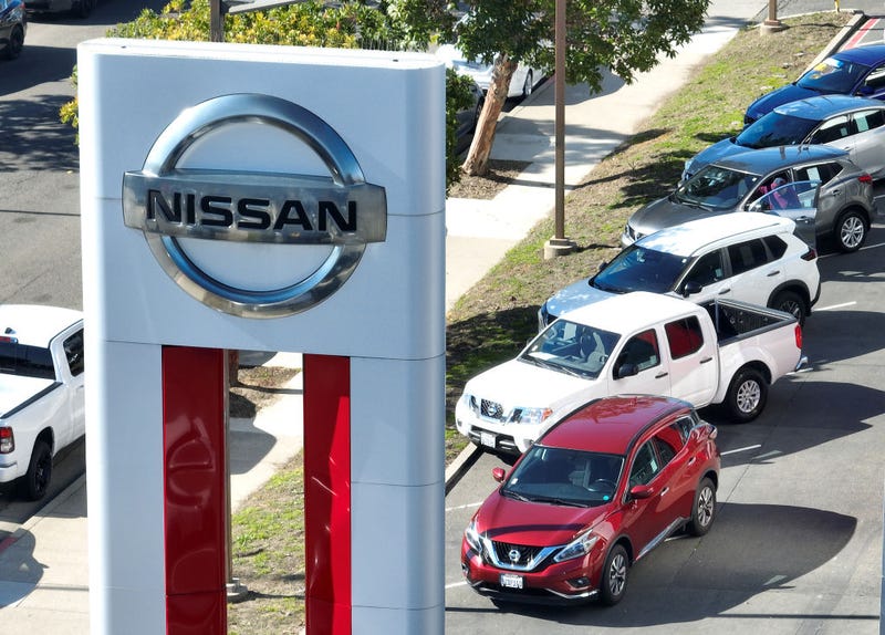 In an aerial view, a sign is posted in front of a Nissan dealership on February 09, 2023 in Richmond, California.