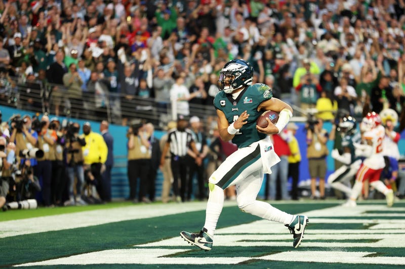Jalen Hurts of the Philadelphia Eagles runs for a four-yard touchdown during the second quarter against the Kansas City Chiefs in Super Bowl LVII at State Farm Stadium on February 12, 2023 in Glendale, Arizona.