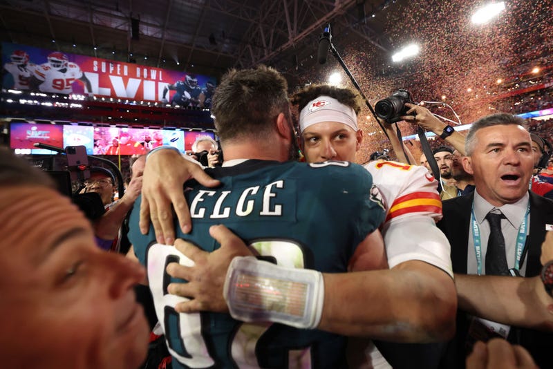 Jason Kelce #62 of the Philadelphia Eagles and Patrick Mahomes #15 of the Kansas City Chiefs embrace on the field after Super Bowl LVII at State Farm Stadium on February 12, 2023 in Glendale, Arizona. 