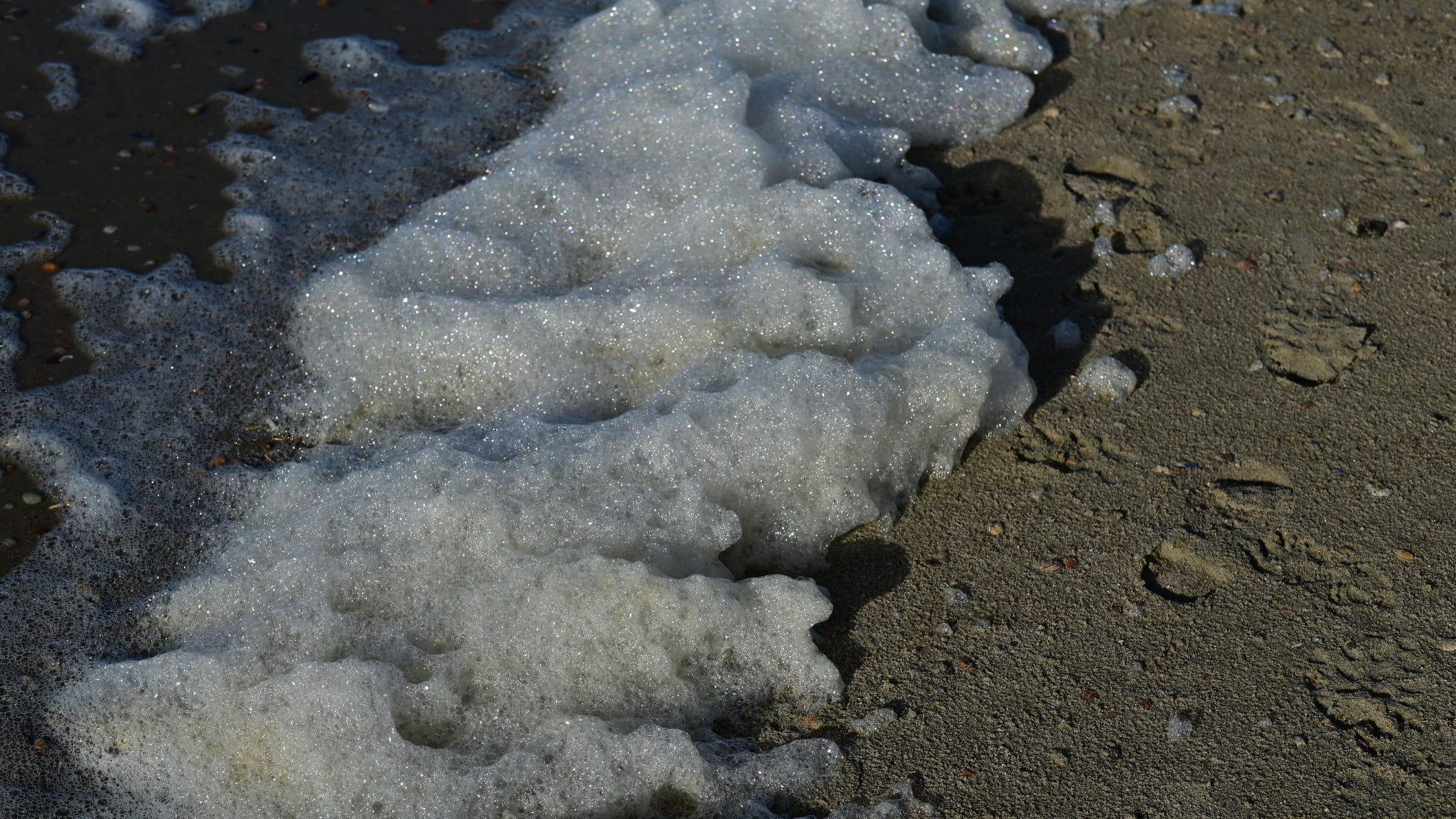 As summer picks up, health officials warning Michiganders to avoid foam piling up on lakes, rivers and beaches