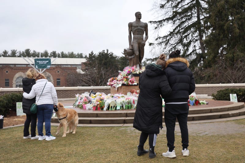 Michigan State University students reflect at Spartan Statue the day after deadly shooting in 2023.