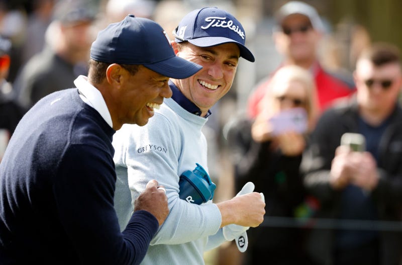 Woods and Thomas share a laugh
