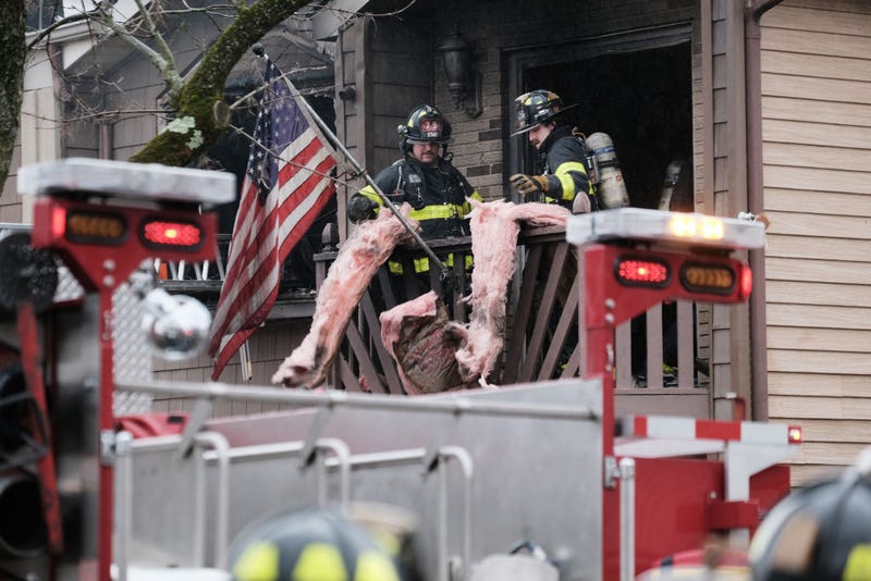 Dozens of firefighters respond to a 4-alarm residential fire in Staten Island on February 17, 2023 in New York City.
