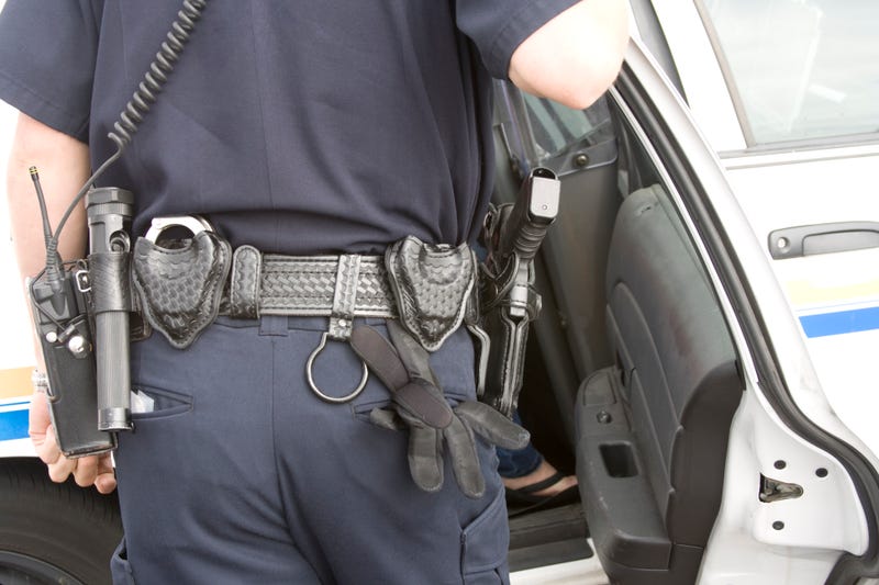 Police officer near car