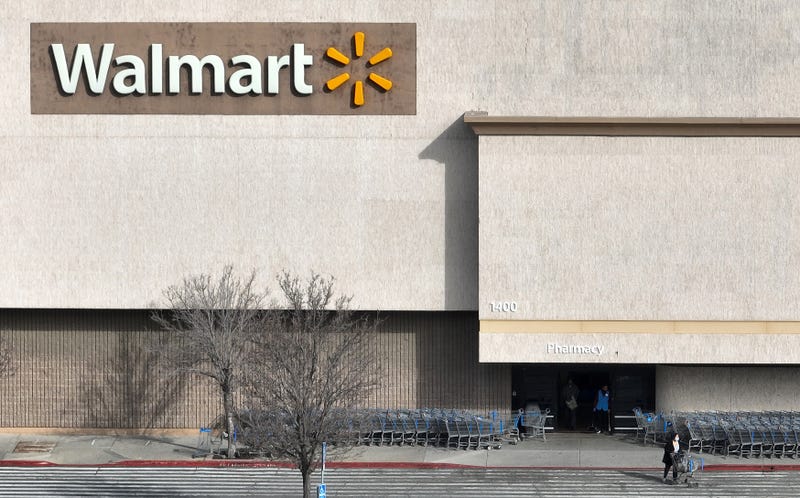 A sign is seen posted on the exterior of a Walmart store on February 21, 2023 in Richmond, California.