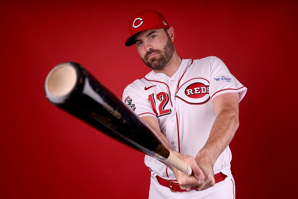 Curt Casali models the Reds sponsorship patch. 