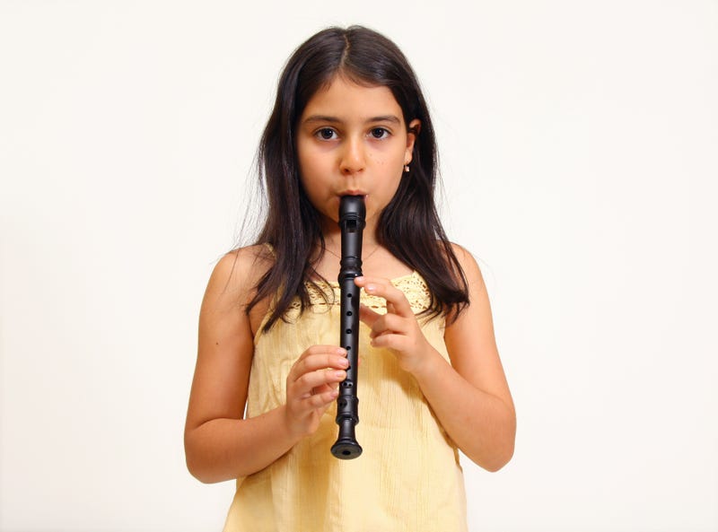 8 year old girl playing recorder