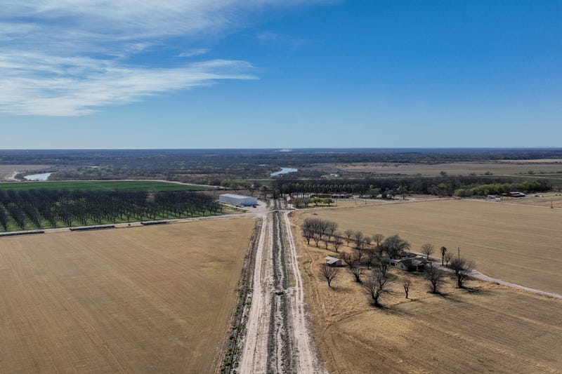 In an aerial view, fields waiting to be irrigated are seen on February 22, 2023 in Quemado, Texas.