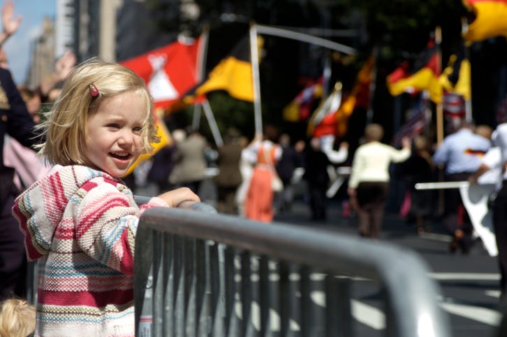 A young female enjoying a parade