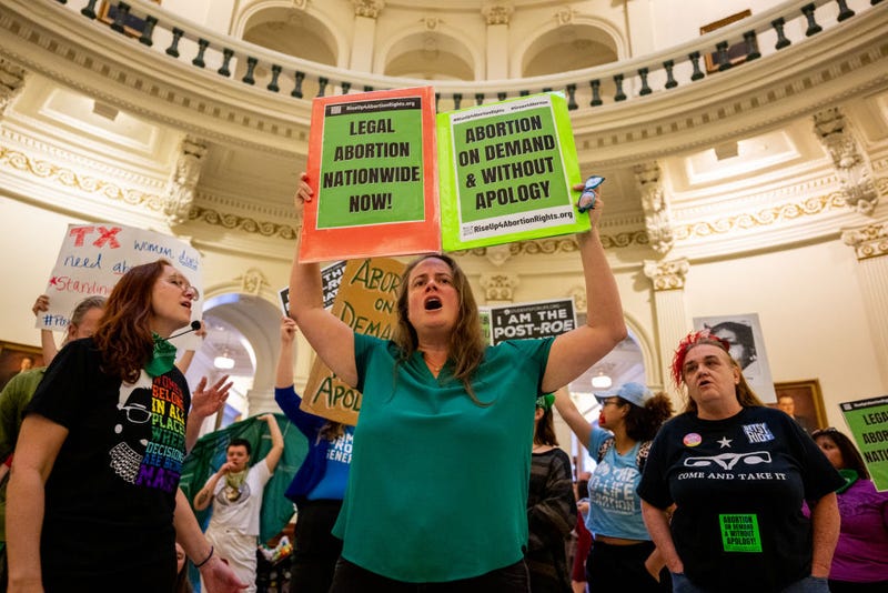 Abortion rights activist Rachel Bailey (C) chants during an International Women's Day abortion rights demonstration at the Texas State Capitol on March 08, 2023 in Austin, Texas. 
