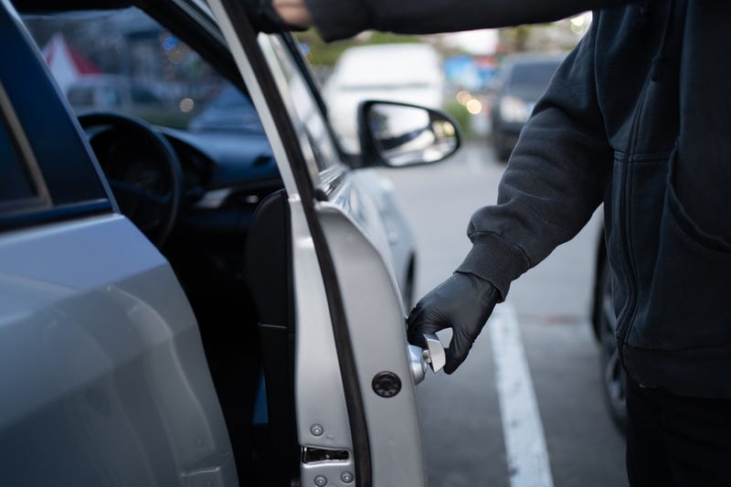 Person breaking into a car