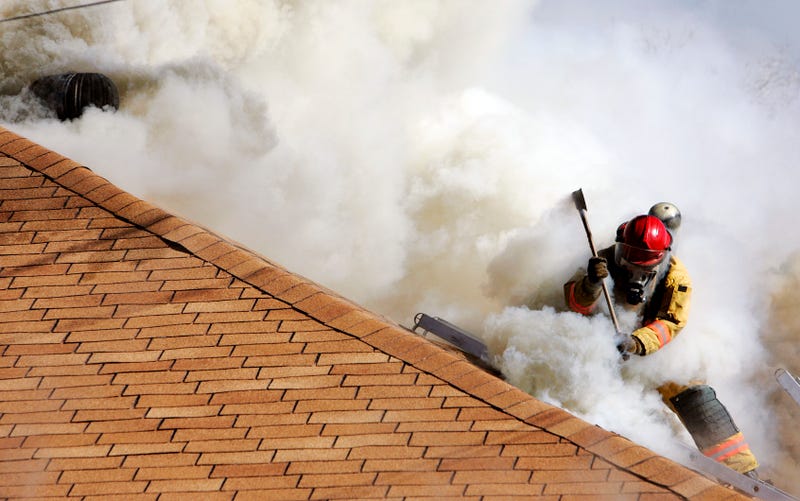 Firefighter On House