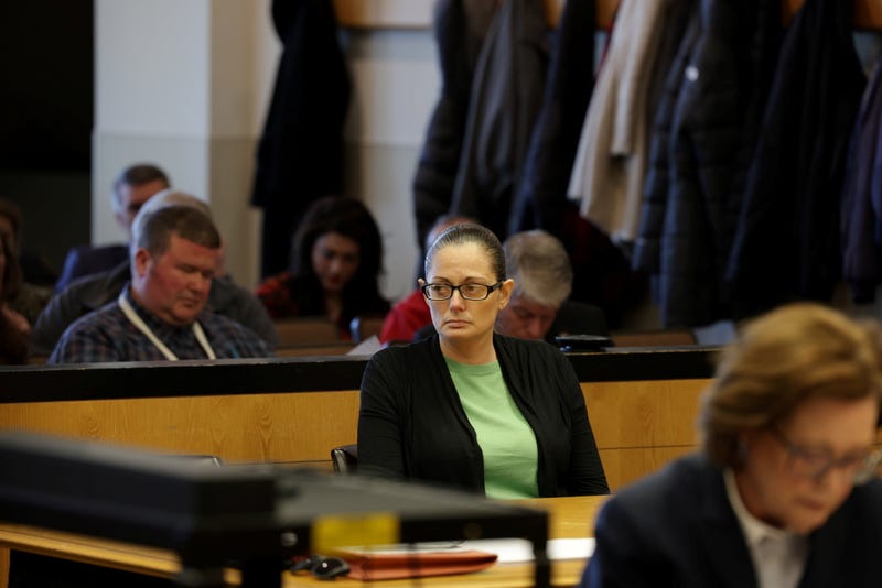 Angela Pollina, a defendant in a murder trial held in a courtroom at Suffolk County Court in Riverhead, New York, listens to closing arguments by her attorney Matt Tuohy, on March 9, 2023.
