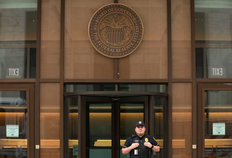 A Federal Reserve police officer guards the entrance to the Federal Reserve’s William McChesney Martin Building as government financial institutions join force to bail out Silicon Valley Bank's account holders after it collapsed on March 13, 2023 in Washington, DC.