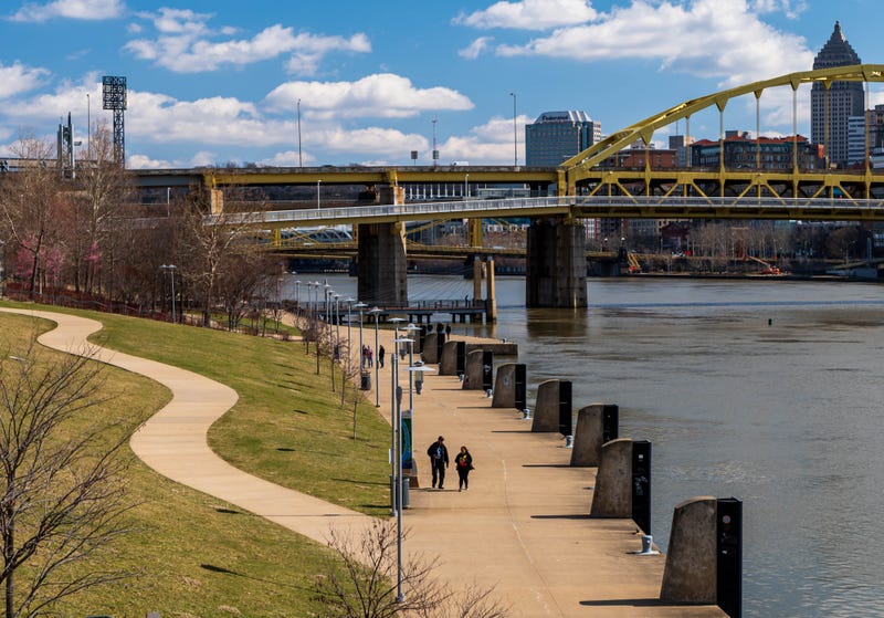 A paved walkway next to the Allegheny River near downtown Pittsburgh, Pennsylvania, USA 