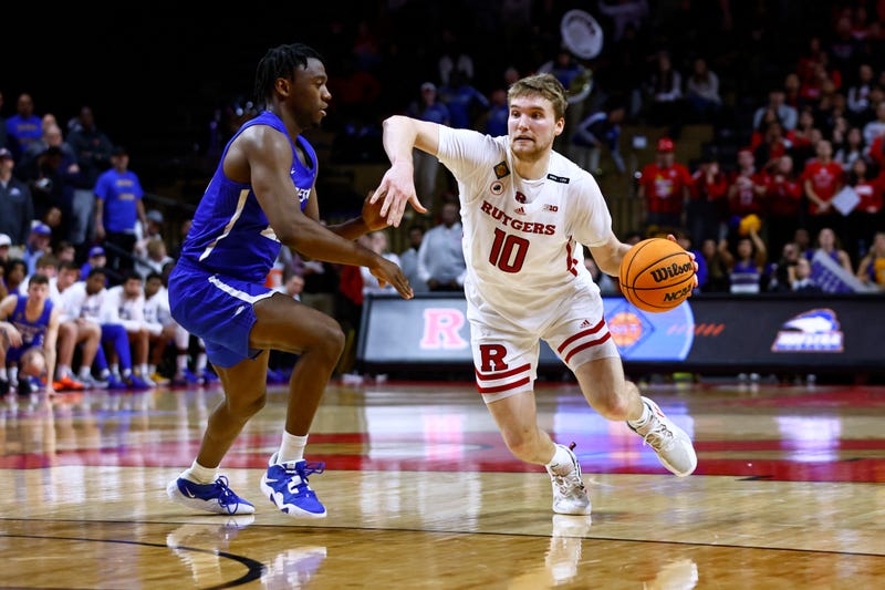 Cam Spencer #10 of the Rutgers Scarlet Knights in action against Tyler Thomas #23 of the Hofstra Pride during a first round NIT tournament game at Jersey Mike's Arena on March 14, 2023 in Piscataway, New Jersey. Hofstra defeated Rutgers 88-86.