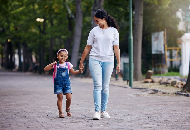 Mother walking with her daughter