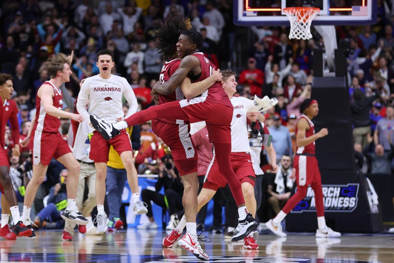 Anthony Black #0 and Davonte Davis #4 of the Arkansas Razorbacks react after defeating the Kansas Jayhawks in the second round of the NCAA Men's Basketball Tournament at Wells Fargo Arena on March 18, 2023 in Des Moines, Iowa.