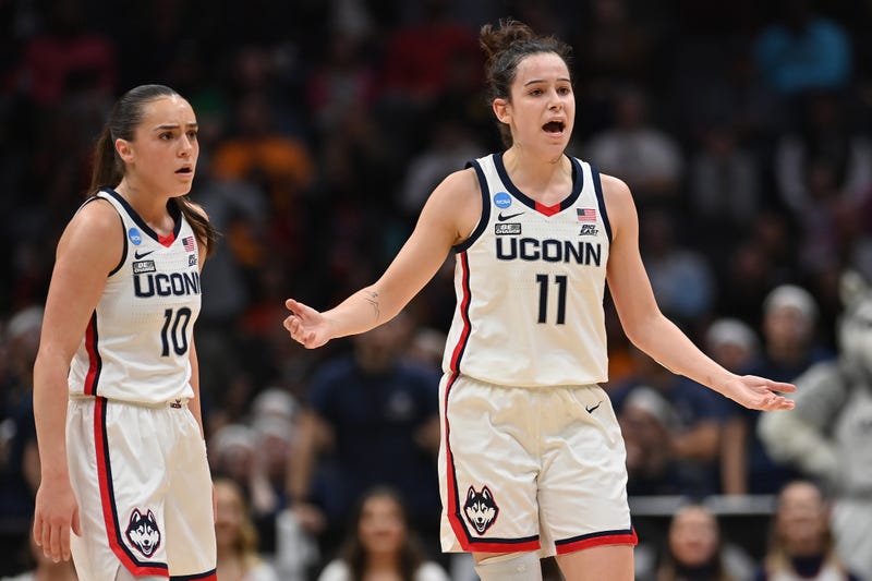 Nika Muhl (#10) and Lou Lopez Senechal (#11) of UConn react during the fourth quarter in the Sweet 16 round of the NCAA Women's Basketball Tournament in Seattle, 3/25/23  