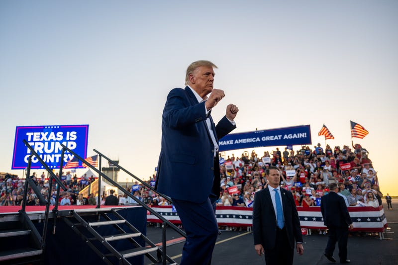 Donald Trump dances while exiting after speaking during a rally at the Waco Regional Airport on March 25, 2023 in Waco, Texas
