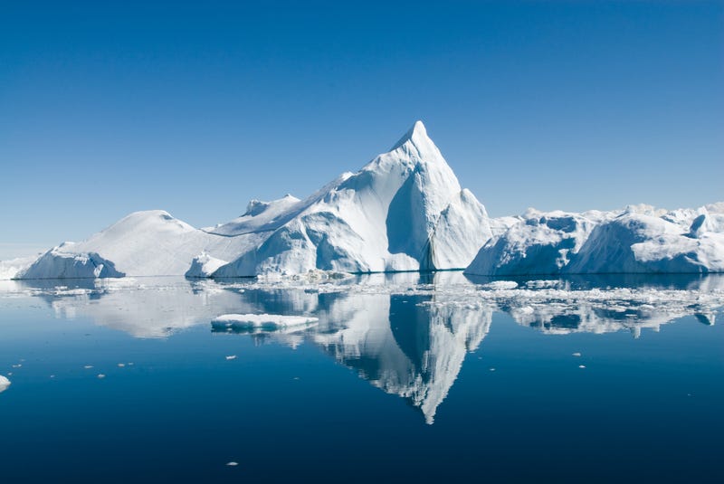 An iceberg floating in the ocean. 